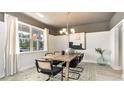 Formal dining room featuring a rustic wooden table and neutral decor at 390 Glacier Way, Conway, SC 29526