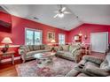 Inviting living area with comfortable seating, a glass coffee table, and hardwood floors at 403 20Th Ave. N, North Myrtle Beach, SC 29582