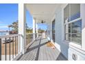 Front porch with gray floor, black railing, ceiling fan, and welcoming mat at 434 Stanley Dr., Murrells Inlet, SC 29576