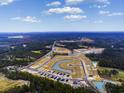 Aerial view of a new residential development with houses and ponds at 467 Ribbon Rail Way, Loris, SC 29569