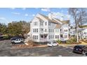 Three-story townhome showcasing a side view with parking and landscaping at 4999 Highway 17 Business # 108 D, Murrells Inlet, SC 29576