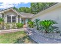 Brick walkway leads to charming house entrance at 600 N 17Th Ave. N, Surfside Beach, SC 29575