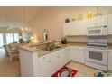 White kitchen with granite countertops and appliances at 601 N Hillside Dr. # 3634, North Myrtle Beach, SC 29582