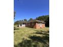 Single story home with brick veneer, a covered porch, and nice grassy lawn at 7195 Hwy 9, Nichols, SC 29581