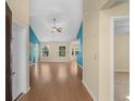 Living room with hardwood floors and teal walls at 820 Trey Ct., Longs, SC 29568