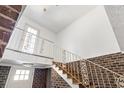 Indoor staircase with ornate railing leading to the upper level at 9095 Highway 701 South, Conway, SC 29527