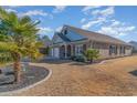 Brick home with a two-car garage and nicely landscaped lawn at 92 Preservation Dr., Myrtle Beach, SC 29572