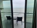 Oceanfront balcony with seating overlooking the beach and water at 107 S Ocean Blvd. # 707, Myrtle Beach, SC 29572