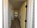 Inviting entryway showcasing hardwood floors and a bright, airy atmosphere with a view into the open floorplan at 140 Joyce Dr, Longs, SC 29568
