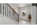 Bright entryway with a staircase, wood flooring, and a potted plant at 1823 Hardwood Ct., Conway, SC 29526