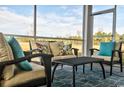 Screened porch features a seating area and overlooks a tranquil backyard at 1823 Hardwood Ct., Conway, SC 29526
