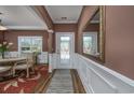 Inviting foyer with hardwood floors, decorative molding, and a view of the dining area at 1829 Wood Stork Dr., Conway, SC 29526