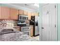Kitchen with stainless steel appliances and granite countertops at 212-C Landing Rd. # 212-C, North Myrtle Beach, SC 29582