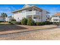 Two-story condo building with manicured landscaping at 300 Shorehaven Dr. # W-4, North Myrtle Beach, SC 29582