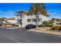 Two-story condo building with parking and landscaping at 300 Shorehaven Dr. # W-4, North Myrtle Beach, SC 29582