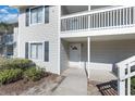 Private entrance to a condo unit with a balcony at 3555 Highway 544 # 2C, Conway, SC 29526