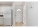 Kitchen entry with white appliances and tiled floor at 3555 Highway 544 # 2C, Conway, SC 29526