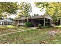 Ranch house with carport, mature trees, and spacious yard at 3657 Highway 472, Conway, SC 29526