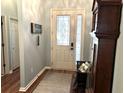 Light-filled entryway featuring hardwood floors, decorative door with glass, and classic decor at 414 Grand Cypress Way, Murrells Inlet, SC 29576