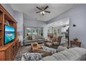 Open concept living room with a view into the kitchen area at 440 Craigflower Ct., Longs, SC 29568