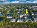Aerial view of condo community situated on a lush green golf course with small ponds at 4459 Turtle Ln. # 3D, Little River, SC 29566