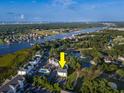 Aerial view of community next to river, golf course, trees, and marshland at 4459 Turtle Ln. # 3D, Little River, SC 29566