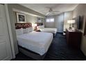 Two double beds, television, and nightstands in a well-lit room at 5300 N Ocean Blvd. # 1005, Myrtle Beach, SC 29577
