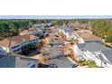 An aerial view of the community, showing the lush landscape, community parking, and building exteriors at 5825 Catalina Dr. # 332, North Myrtle Beach, SC 29582