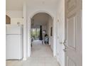 Inviting entryway featuring an arched doorway, tile flooring, and direct access to the kitchen and living area at 5825 Catalina Dr. # 332, North Myrtle Beach, SC 29582