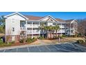 Two-story condo building with balconies and parking at 5825 Catalina Dr. # 332, North Myrtle Beach, SC 29582
