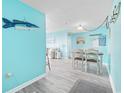 Beach-themed dining area with light wood table and chairs at 5905 S Kings Hwy. # 312-C, Myrtle Beach, SC 29575
