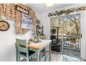 A cozy dining space with walkout to outdoor patio that features a multi-tiered cat tower at 6702 Jefferson Pl. # B6, Myrtle Beach, SC 29572