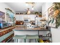 A cozy kitchen boasts bar seating, white appliances, and decorative accents for a homey atmosphere at 6702 Jefferson Pl. # B6, Myrtle Beach, SC 29572