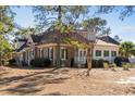 Side view of house showing additional details and landscaping at 7403 Haddington Pl., Sunset Beach, NC 28468