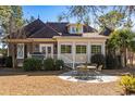 Back of house showing sunroom and patio area at 7403 Haddington Pl., Sunset Beach, NC 28468