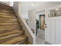 Inviting entryway features a staircase and an open doorway leading to the kitchen at 831 Villa Dr. # 831, North Myrtle Beach, SC 29582