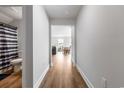 Hallway with a bathroom to the left and views of the living room and dining area ahead at 1052 Kinness Dr., Conway, SC 29527