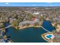 Aerial view showcasing building's location near a lake and pool at 108 Rothbury Circle # 207, Myrtle Beach, SC 29572