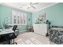 Bedroom with a pull-out Murphy bed, chair, desk and an accent rug at 116 Cypress Estates Dr., Murrells Inlet, SC 29576