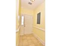 Condo entryway featuring ceramic tile, neutral paint, and white door at 118 Birch N Coppice Dr. # 3, Surfside Beach, SC 29575