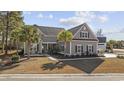 Charming two-story home features a landscaped yard, symmetrical design, and inviting curb appeal at 1196 Fiddlehead Way, Myrtle Beach, SC 29579