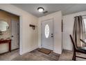 Inviting entryway featuring a white door, neutral walls, and wood-look flooring at 124 Blue Jacket Dr., Galivants Ferry, SC 29544