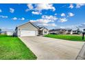 Charming single-story home with a large driveway and well-manicured front lawn at 124 Blue Jacket Dr., Galivants Ferry, SC 29544