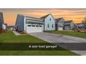 Rear load garage with concrete driveway and grassy area at 130 Black Water Dr., Murrells Inlet, SC 29576