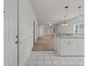 Bright living area featuring tile floors, fresh paint, and a seamless transition to the carpeted living area at 1538 Lanterns Rest Rd. # 103, Myrtle Beach, SC 29579