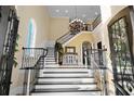 Elegant two-story entry with a grand staircase and chandelier at 1601 Waterway Dr., North Myrtle Beach, SC 29582