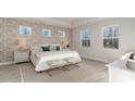 Bright main bedroom with a patterned wall and king-size bed at 1844 Hardwood Ct., Conway, SC 29526