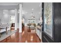 Elegant foyer featuring hardwood floors, white trim, and a view into the living room at 212 Minnow Ln., Murrells Inlet, SC 29576