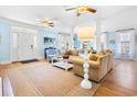 Spacious living room with hardwood floors, blue accents, and open floor plan at 438 Cayman Loop, Pawleys Island, SC 29585