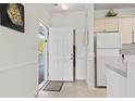 Inviting entryway with tile floor and a white door leading to a bright, clean interior at 4851 Luster Leaf Circle # 302, Myrtle Beach, SC 29577